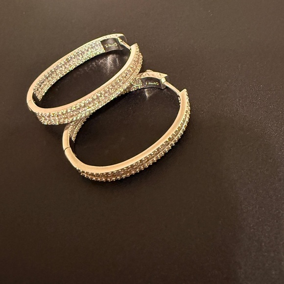 Elegant – These sparkling hoop earrings have a refined and sophisticated look. - Picture 3 of 14